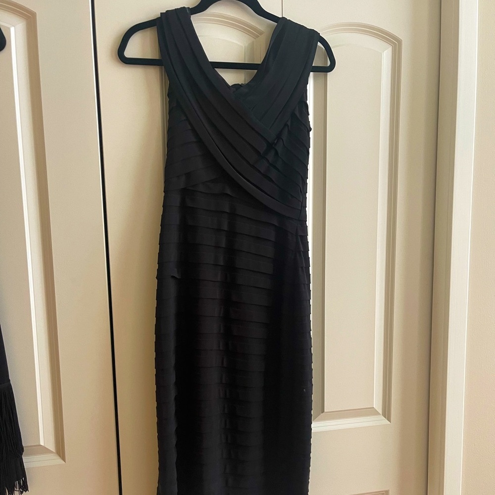 Beautiful mint condition black cocktail dress.  Cache size 6